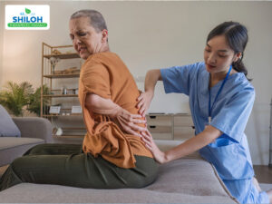 Massage therapist demonstrating gentle massage techniques for sciatica relief in Billings, Montana